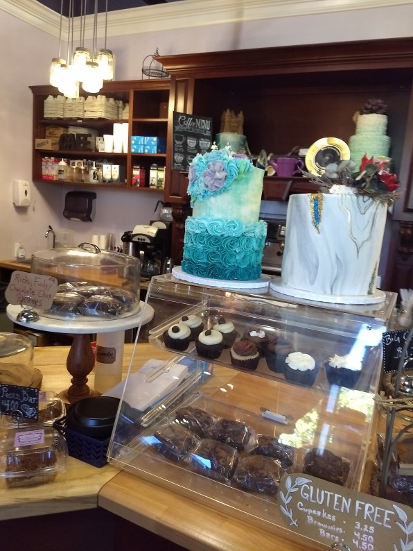 Part of the counter at Sweet T's, with two full-size cakes and a few smaller displays